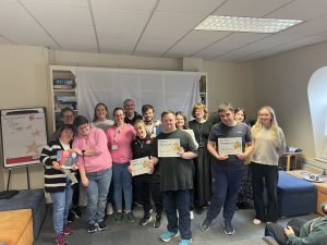 The Popes Quay Horizons Hub members show off their participation certificates from the Cybersafety video competition (November 2025).