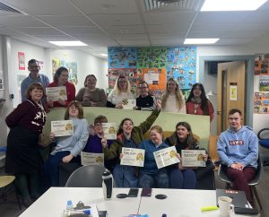 The South Main Street Horizons Hub members show off their participation certificates from the Cybersafety video competition (November 2025).